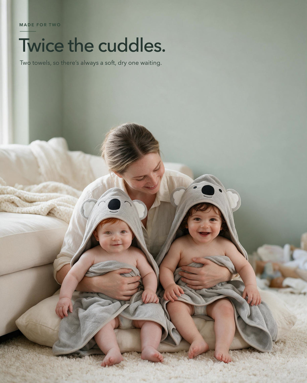 Two babies in the Koala and Sleepy Koala towels with their mother