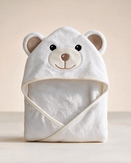 Little Bear hooded baby towel in white with taupe ears, on a cream background
