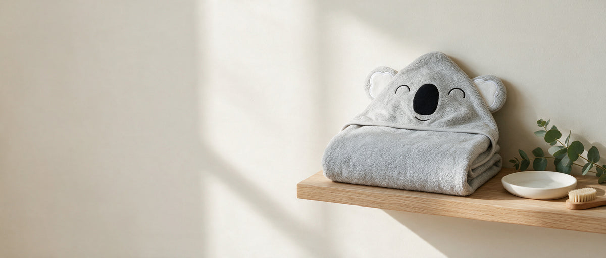 The Sleepy Koala towel folded on a shelf