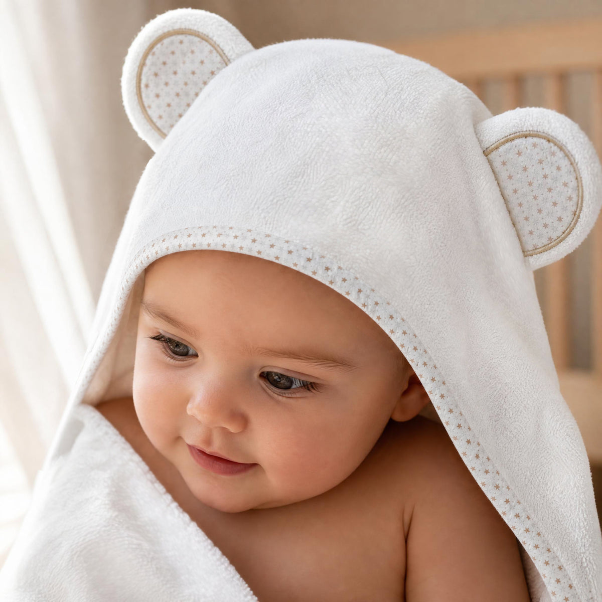 Close-up of a baby in the Starry Bear hood