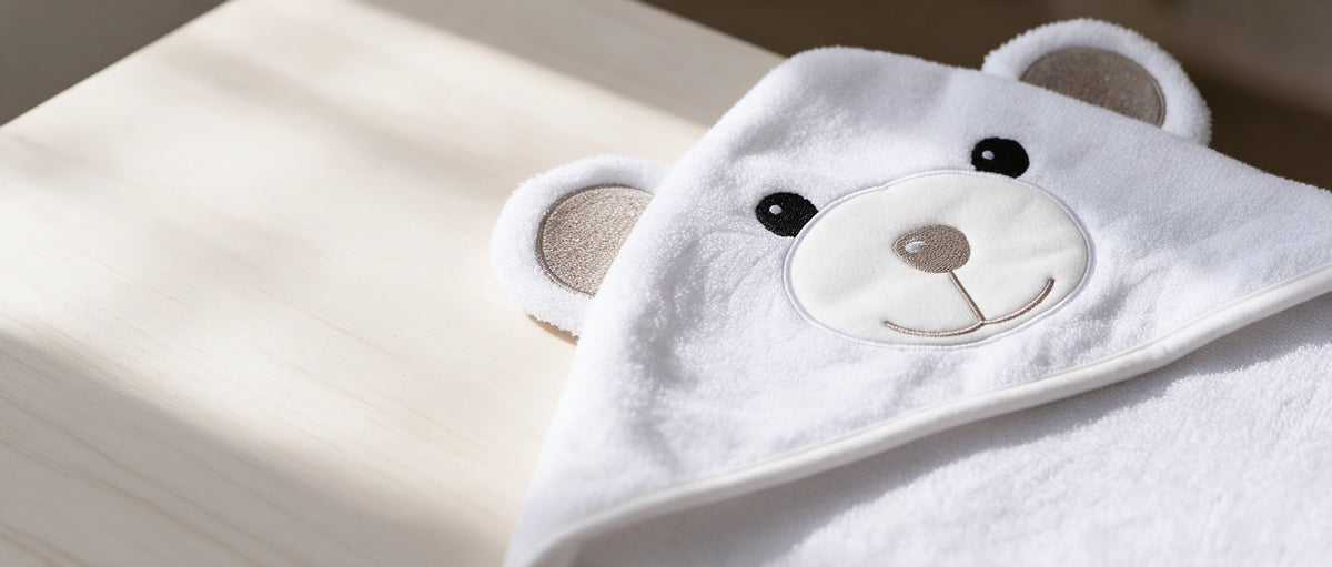 Close-up of the bear face on The Bear hooded towel