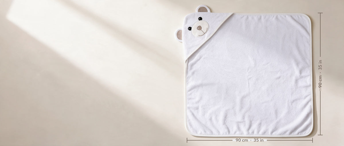 The Bear hooded towel laid flat, 90 × 90 cm (35 × 35 in)