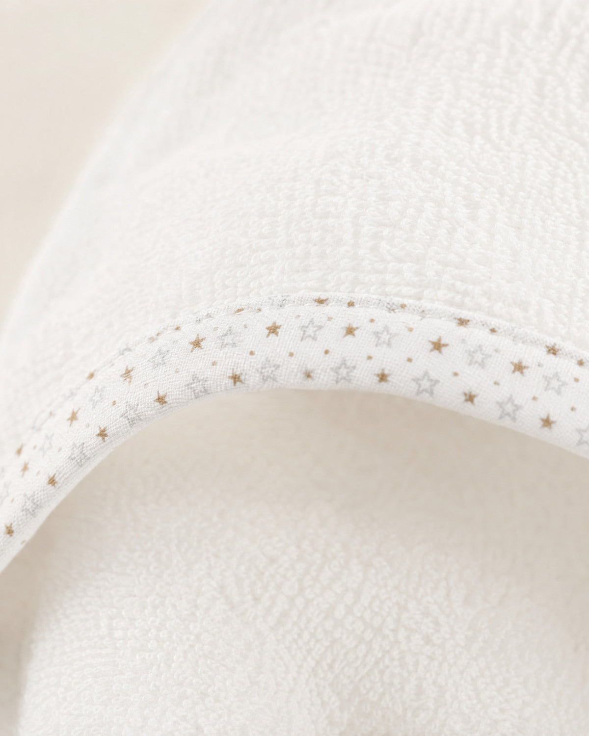 Close-up of the soft terry and the star-print binding