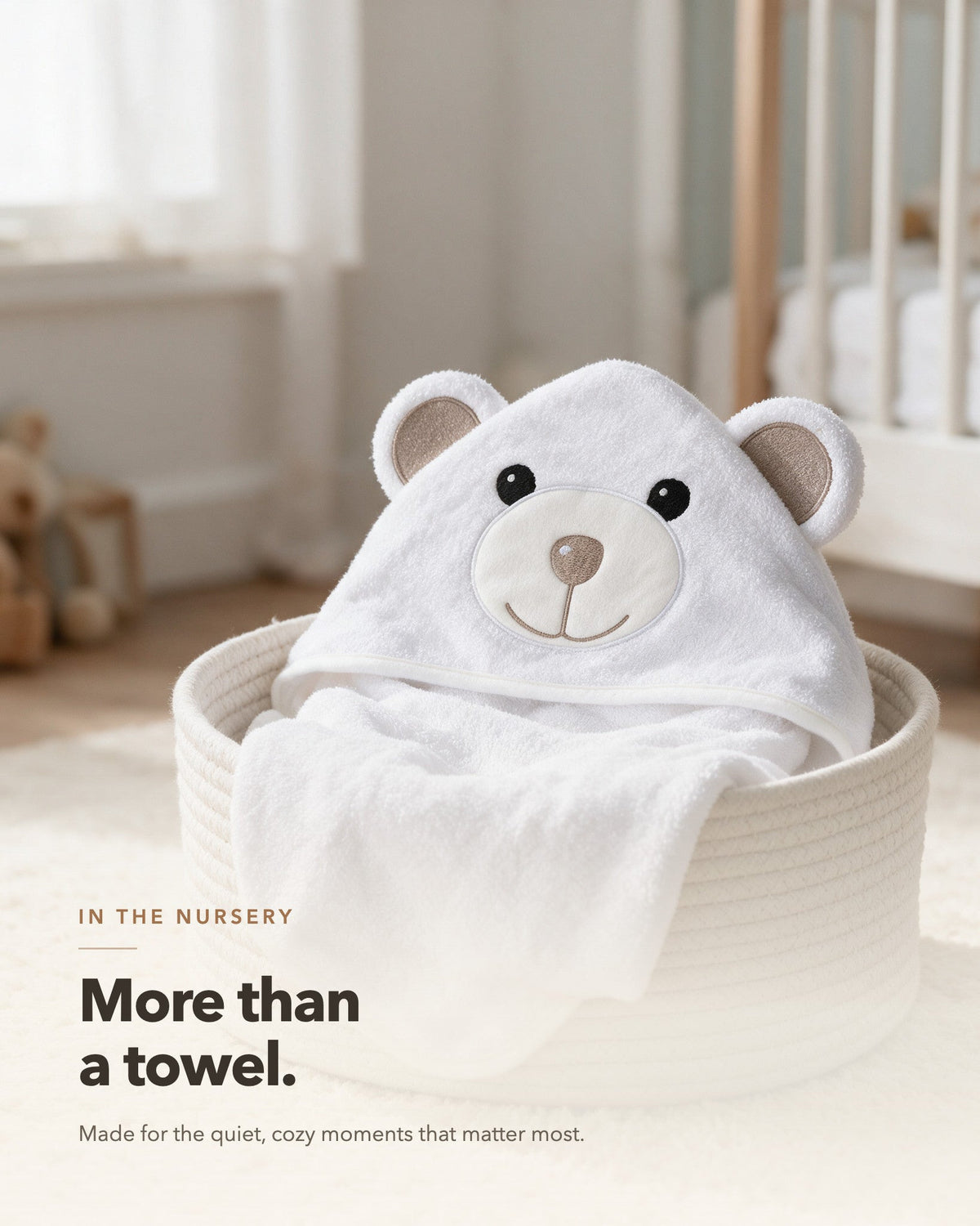 More than a towel – The Bear hooded towel in a nursery basket