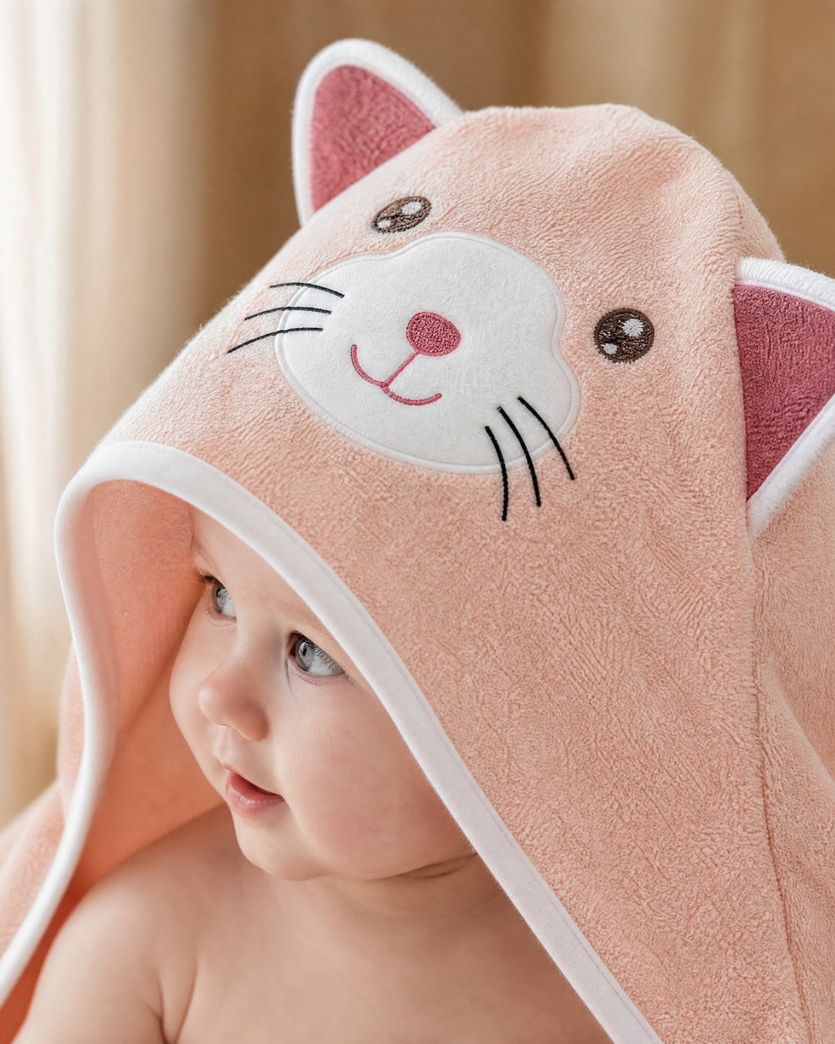 Close-up of the embroidered cat face and ears on the hood
