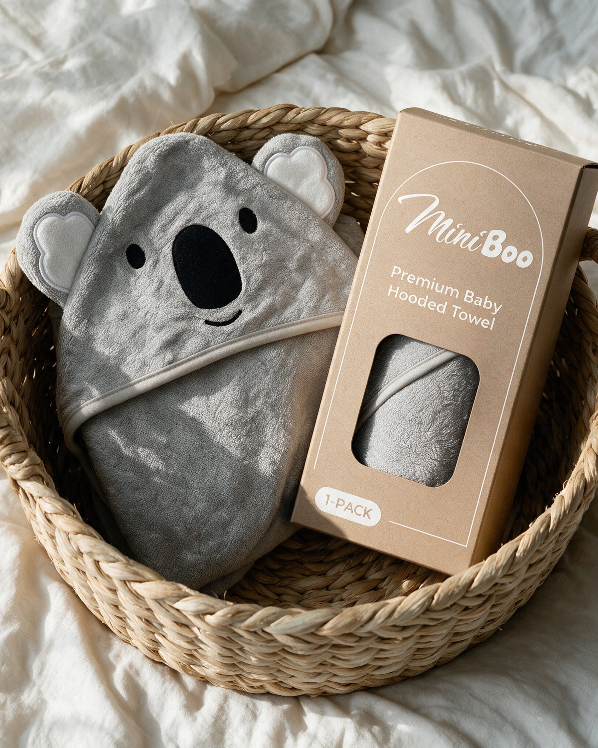 The Koala towel with its MiniBoo gift box in a basket