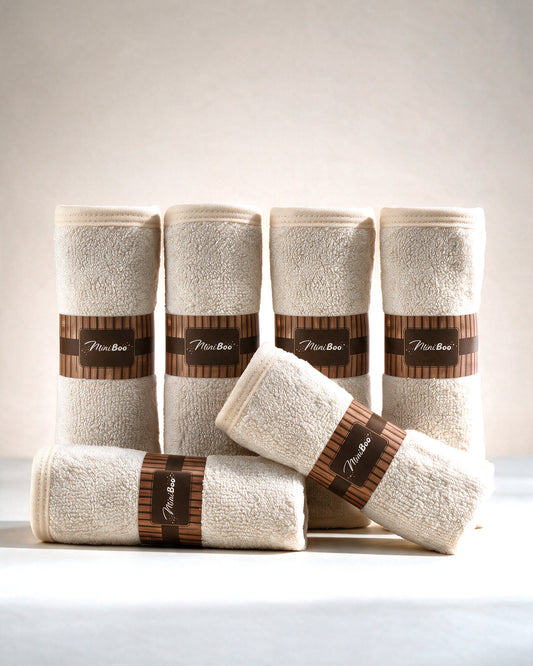 MiniBoo cream baby washcloths, set of 6 rolled with kraft bands, on a cream background