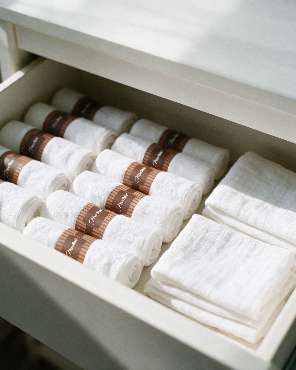 White washcloths stored in a nursery drawer